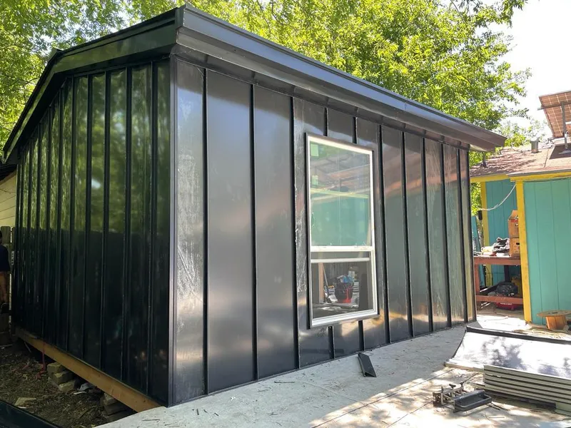 Black standing seam metal wall panels for Roof Inspection in Itasca