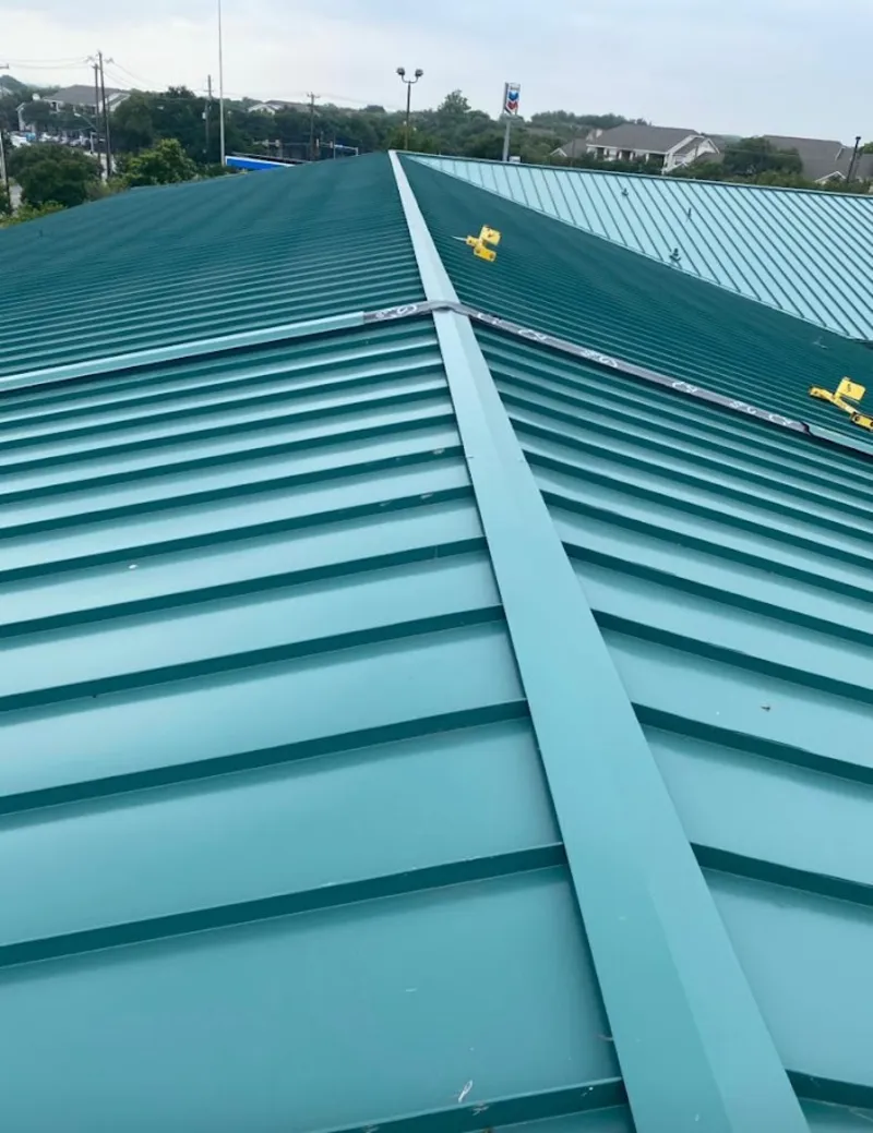 Green commercial metal roof ridge and valley for Metal Roof Repair in Itasca